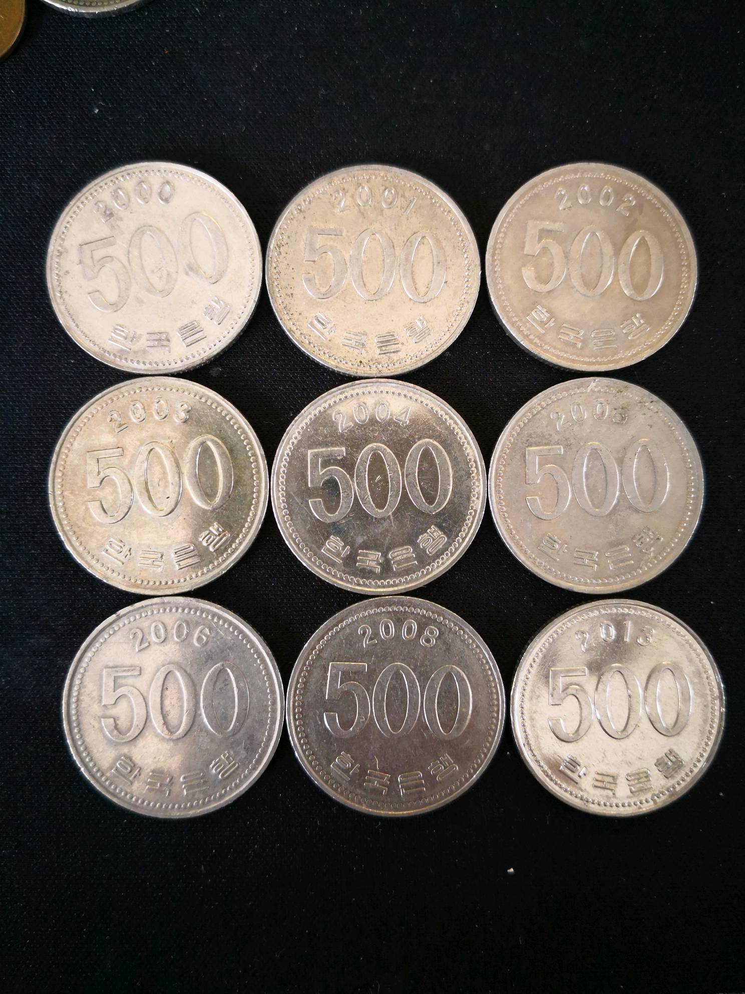 韩币500元九枚00至06,0