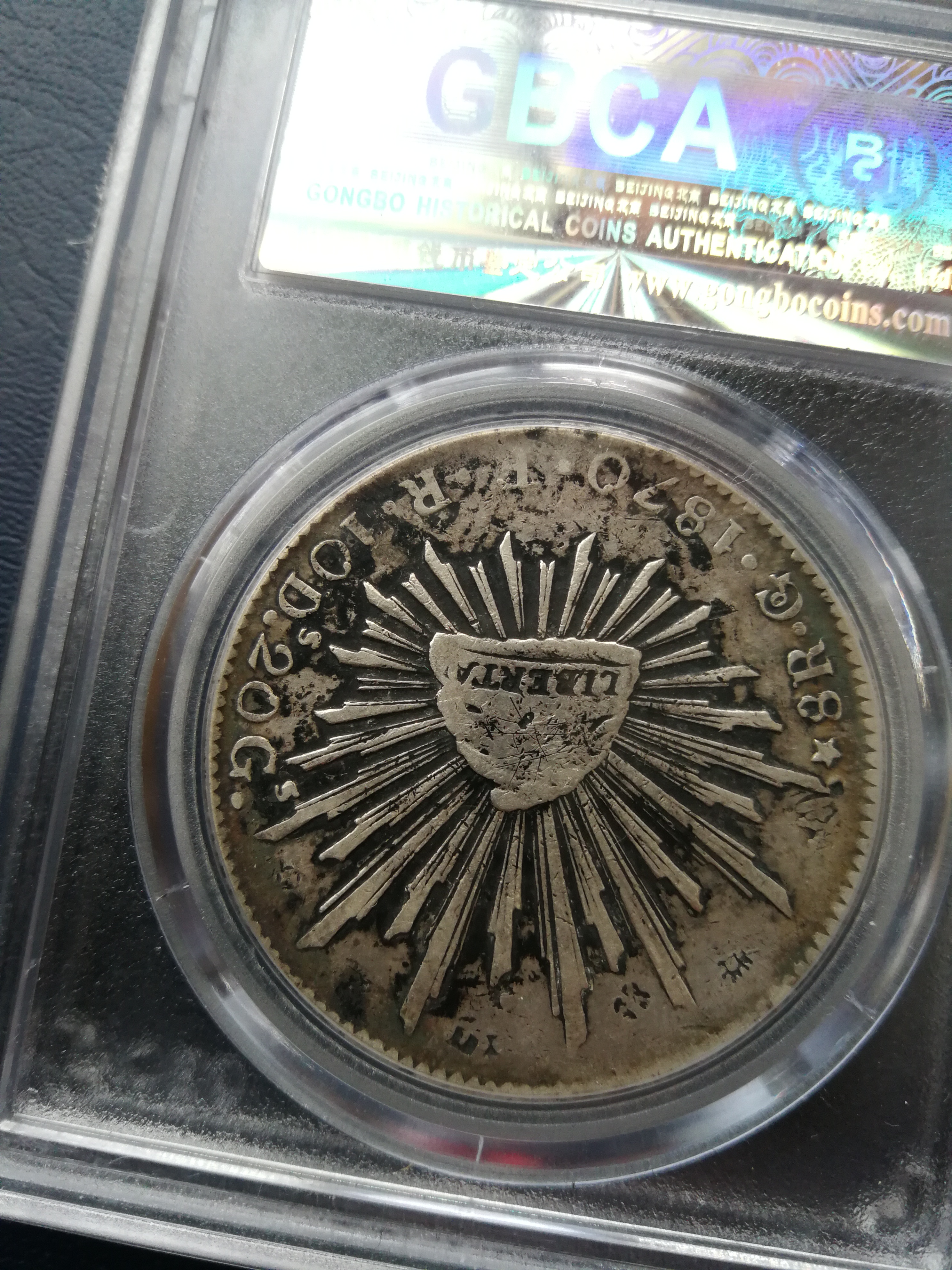 公博评级xf09,09是有戳,几乎大部分鹰洋都有戳,过去银庄的一种防伪