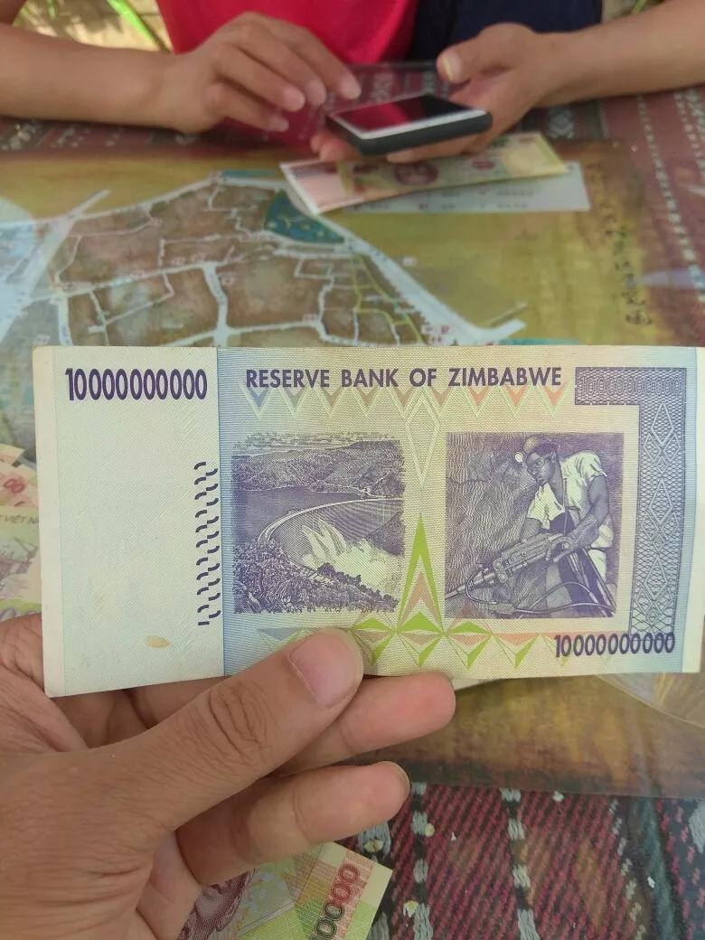 津巴布韦100亿最大面值万亿九成新单张真币号码随机