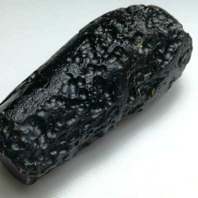 玻璃陨石虫纹长条原石点击左上角头像